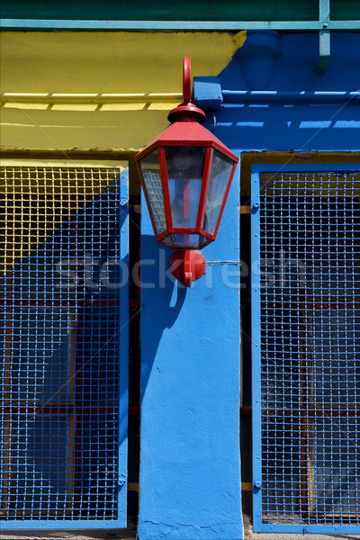 red street lamp  and a yellow blue wall  in la boca Stock photo © lkpro
