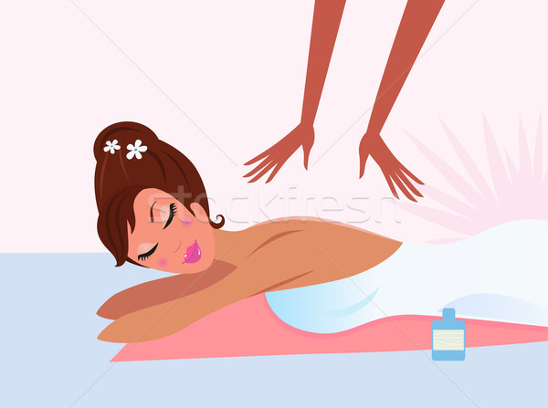 Stock photo: Woman receiving back massage with closed eyes
