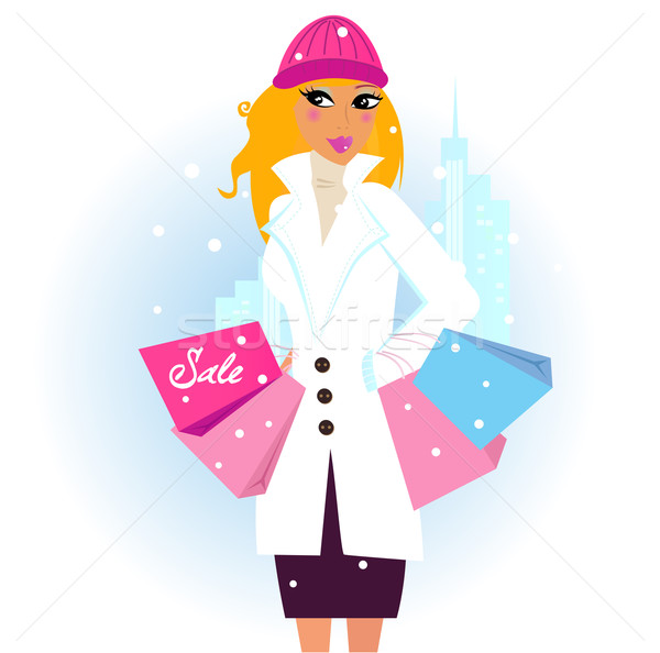 Stock photo: Winter shopping: Beautiful brown hair woman with pink shopping bags in the city
