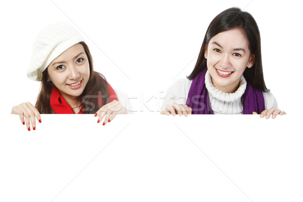 Fiatal nők fölött üres hely tart fehér kártya Stock fotó © lorenzodelacosta