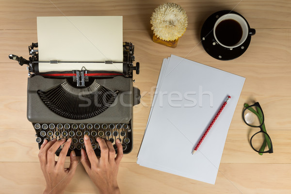 vintage typewriter with work stuff and hands overhead Stock photo © lostation