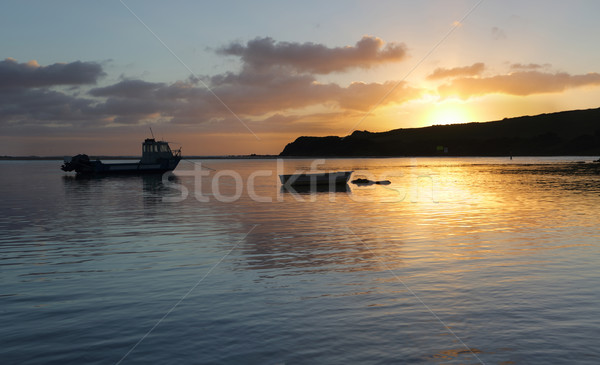 Boats on the water at sunrise Stock photo © lovleah