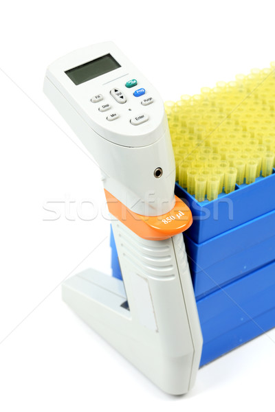 Electronic pipettor and tray of pipet tips Stock photo © lovleah