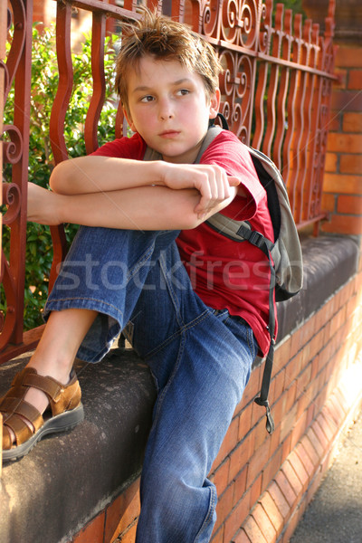 Boy with schoolbag slung over shoulder Stock photo © lovleah