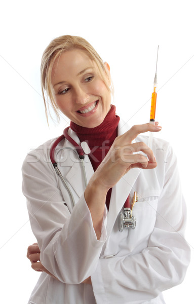 Physician or vet holding needle syringe Stock photo © lovleah