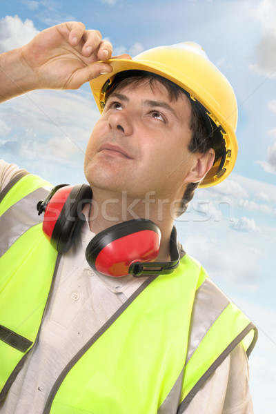 Engineer or builder looking up at progress Stock photo © lovleah