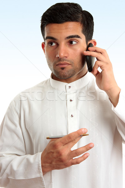 Ethnic business man using phone Stock photo © lovleah