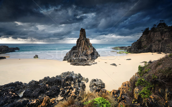 Moody storm clouds loom over Pyramid sea stack Stock photo © lovleah