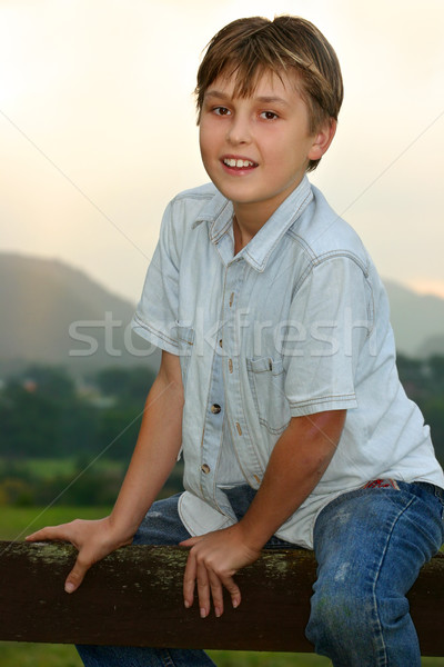 Child sitting on fence Stock photo © lovleah
