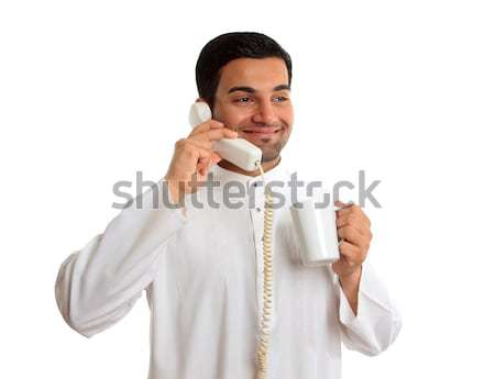 Friendly smiling ethnic businessman on telephone Stock photo © lovleah