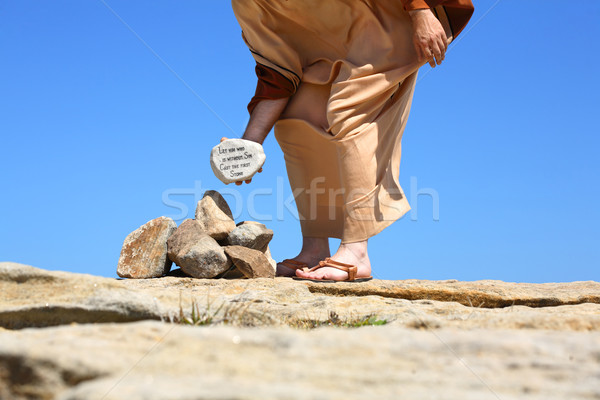 Pecado primeiro pedra homem em pé sol Foto stock © lovleah