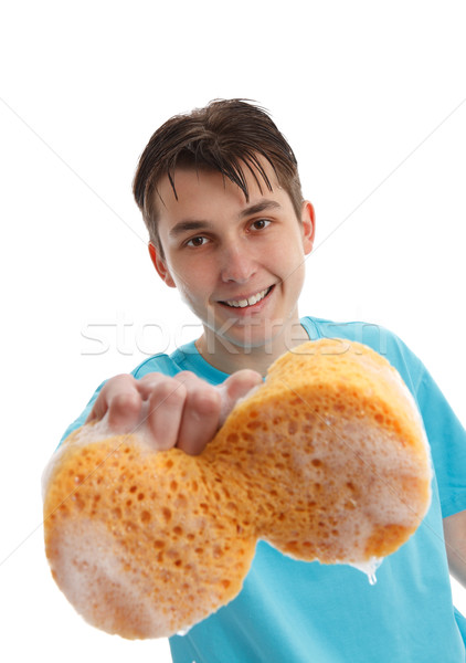 Stock photo: Boy using a soapy sponge to clean