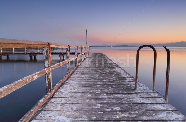 Whitewashed jetty at dusk Stock photo © lovleah