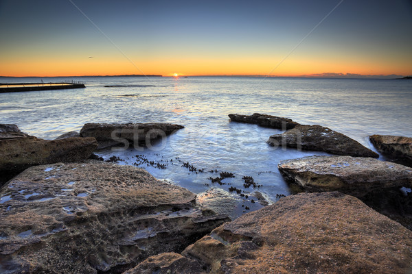 Sunrise over the ocean Stock photo © lovleah