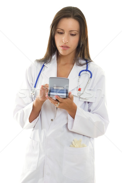 Doctor using a portable device with medical software. Stock photo © lovleah