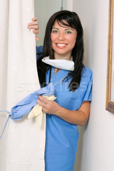 Friendly nurse doctor entering hospital ward Stock photo © lovleah