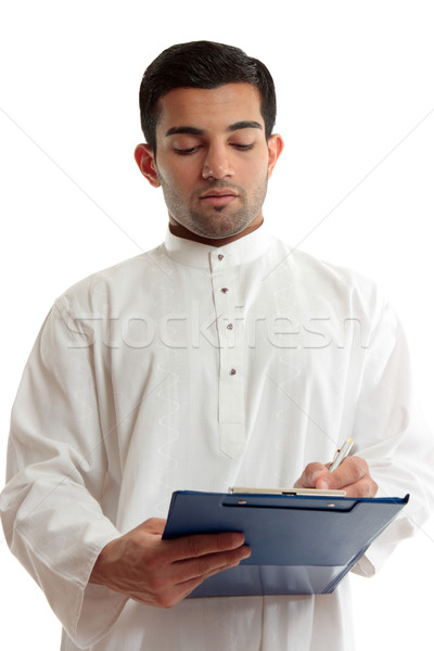 Ethnic business man writing  Stock photo © lovleah