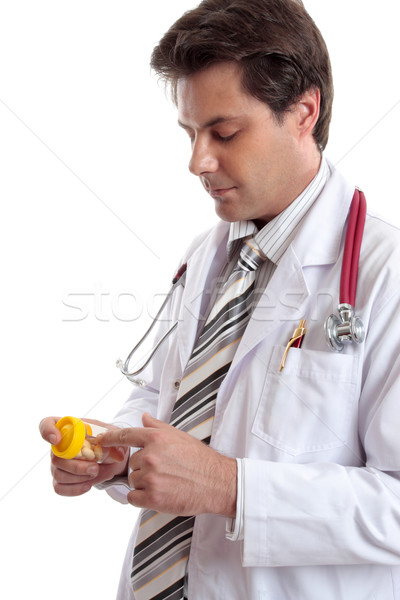 Doctor or pharmacist with medicine. Stock photo © lovleah