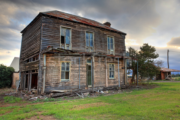 Stock photo: Old abandoned two storey wooden farmhouse