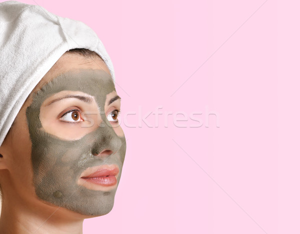 Beautiful female in clay beauty mask Stock photo © lovleah