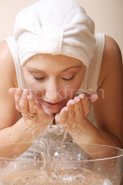 Szépség arc nő kezek édesvíz tál Stock fotó © lovleah