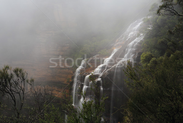 Blue Mountains and waterfall in heavy fog Stock photo © lovleah