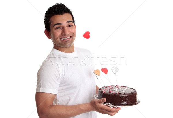 Man holding delicious chocolate cake decorated with love hearts Stock photo © lovleah