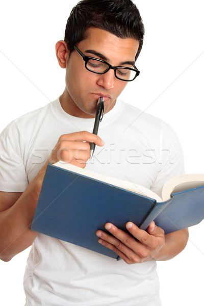 Man or student pondering or thinking intently Stock photo © lovleah