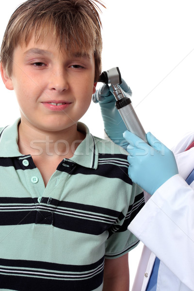 Stock photo: Doctor checking boys ears