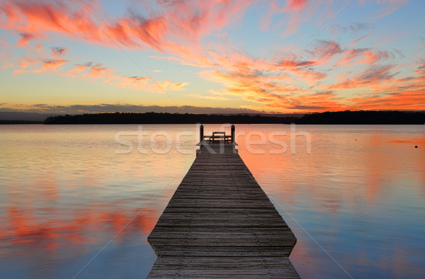 Sunset over St Georges Basin with timber jetty Stock photo © lovleah