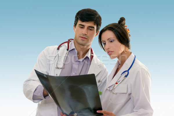 Two doctors conferring over x-ray results Stock photo © lovleah