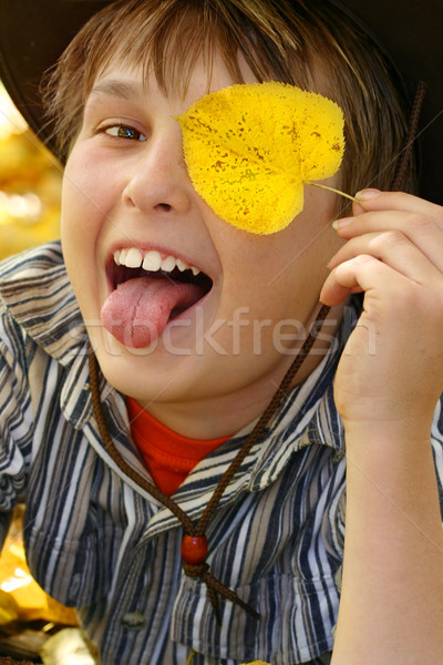 Happy fun boy playing with leaves in the autumn fall Stock photo © lovleah