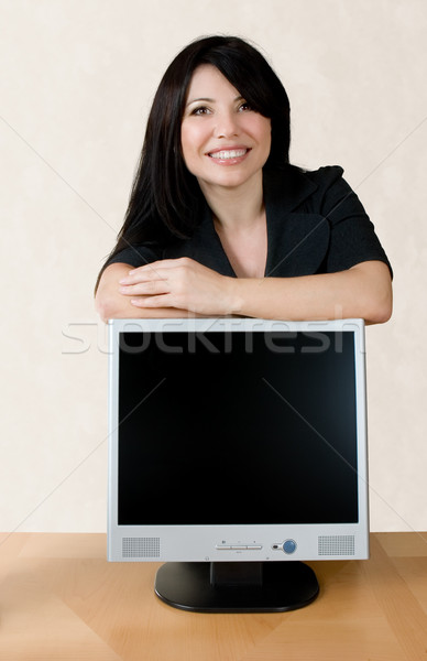 Vonzó nő dől LCD képernyő mosolyog üzletasszony Stock fotó © lovleah