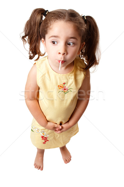Aranyos lány nyalóka cukorka kicsi haj Stock fotó © lovleah