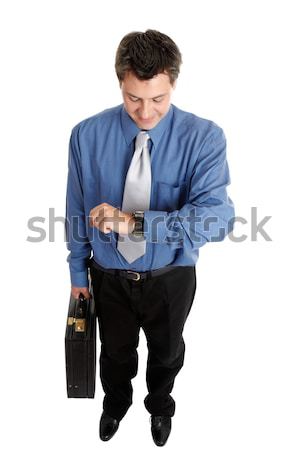 Businessman checking time Stock photo © lovleah