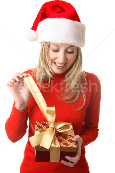 Female opening a Christmas present Stock photo © lovleah