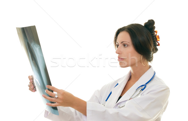 Stock photo: Doctor or medical professional analysing a patient's x-ray