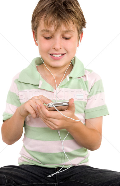 Child using a digital player Stock photo © lovleah