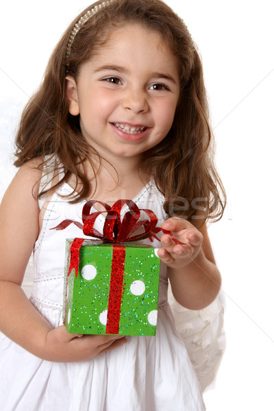 Stock photo: Angelic girl holding a gift