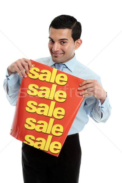 Retail salesman holding a sale sign banner Stock photo © lovleah