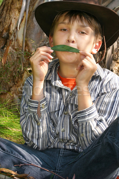 Green Music - A Boy playing gumleaf tune Stock photo © lovleah