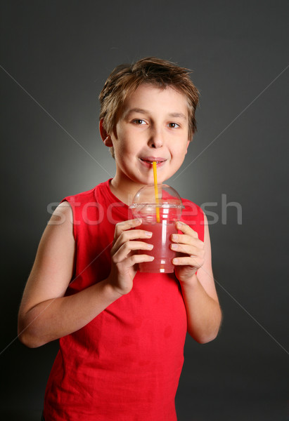 Child drinking fresh berry fruit juice Stock photo © lovleah
