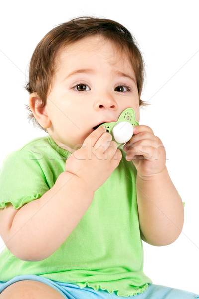 Baby putting a dummy into mouth Stock photo © lovleah