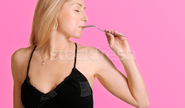 Gusto bella mangiare attraente ragazza forcella rosa Foto d'archivio © lovleah