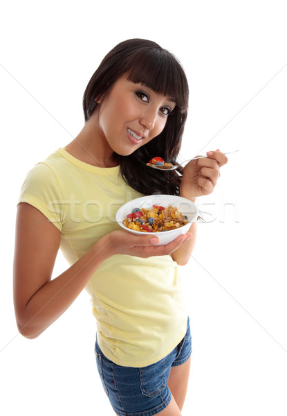 Mananca nutritiv mic dejun tineri femeie zambitoare Imagine de stoc © lovleah