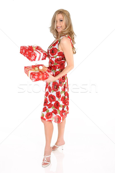 Smiling woman holding Christmas presents Stock photo © lovleah