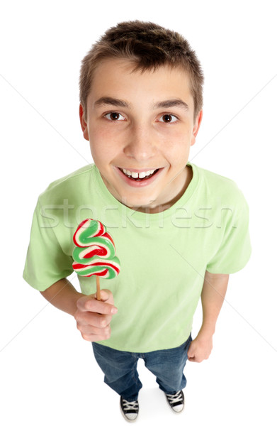 Happy boy holding a lollipop candy Stock photo © lovleah