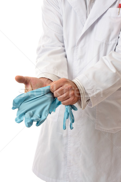 Doctor or Scientist putting on gloves Stock photo © lovleah