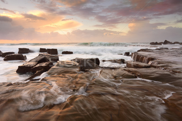 óceán szörf napfelkelte magas hullámok kő Stock fotó © lovleah