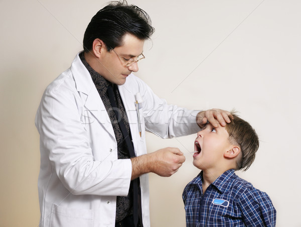 Doctor assessing child Stock photo © lovleah